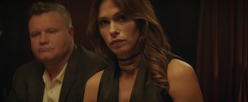 Movie still from “Molly's Game” (2017), directed by Aaron Sorkin – A person wearing a dress; Close Up shot, Over the shoulder angle