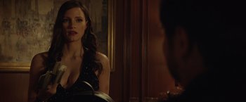 Movie still from “Molly's Game” (2017), directed by Aaron Sorkin – A beautiful woman standing in front of a bathroom mirror; Close Up shot, Over the shoulder angle