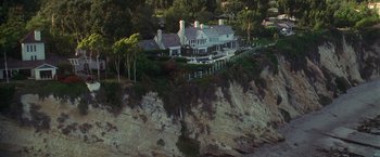Movie still from “Molly's Game” (2017), directed by Aaron Sorkin – An aerial view of a house on the side of a cliff; Extreme Wide shot, High angle