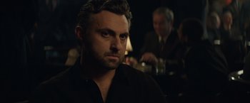 Movie still from “Molly's Game” (2017), directed by Aaron Sorkin – A person wearing a black shirt; Close Up shot, Over the shoulder angle