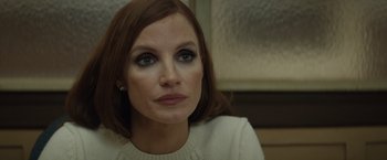 Movie still from “Molly's Game” (2017), directed by Aaron Sorkin – A person wearing a sweater; Close Up shot, Over the shoulder angle