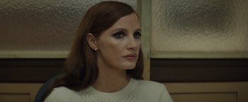 Movie still from “Molly's Game” (2017), directed by Aaron Sorkin – A person wearing a white shirt; Close Up shot, Over the shoulder angle