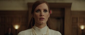 Movie still from “Molly's Game” (2017), directed by Aaron Sorkin – A person wearing a white shirt; Close Up shot, Low angle