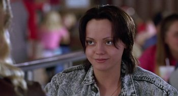 Movie still from “Monster” (2003), directed by Patty Jenkins – A person wearing a jean jacket; Close Up shot, Over the shoulder angle