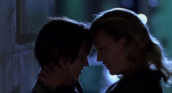 Movie still from “Monster” (2003), directed by Patty Jenkins – Two people are touching heads in the dark; Close Up shot, Low angle