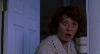 Movie still from “Monster” (2003), directed by Patty Jenkins – A person with a surprised look on their face; Close Up shot, Low angle