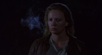 Movie still from “Monster” (2003), directed by Patty Jenkins – A woman is smoking a cigarette in the dark; Close Up shot, Low angle