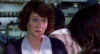 Movie still from “Monster” (2003), directed by Patty Jenkins – A person wearing a jacket; Close Up shot, Over the shoulder angle