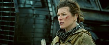Movie still from “Monster Hunter” (2020), directed by Paul W.S. Anderson – A person with a bandage on her face; Close Up shot, Low angle