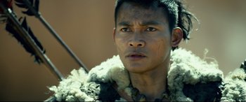 Movie still from “Monster Hunter” (2020), directed by Paul W.S. Anderson – A person wearing a fur coat; Close Up shot, Over the shoulder angle