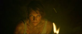 Movie still from “Monster Hunter” (2020), directed by Paul W.S. Anderson – A person in a dark room; Close Up shot, Low angle