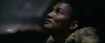 Movie still from “Monster Hunter” (2020), directed by Paul W.S. Anderson – A person looking up at the sky; Close Up shot, Low angle