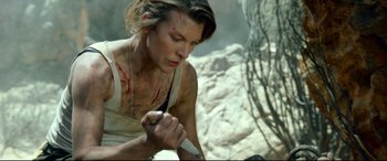 Movie still from “Monster Hunter” (2020), directed by Paul W.S. Anderson – Milla jovovich in a scene from resident evil : retribution; Medium shot, Low angle