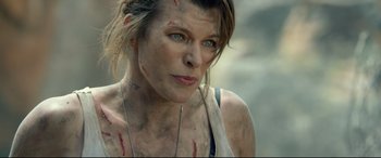 Movie still from “Monster Hunter” (2020), directed by Paul W.S. Anderson – A person with a tattoo on her face; Close Up shot, Over the shoulder angle