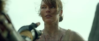 Movie still from “Monster Hunter” (2020), directed by Paul W.S. Anderson – A person with a tattoo on their face; Close Up shot, Low angle