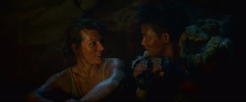 Movie still from “Monster Hunter” (2020), directed by Paul W.S. Anderson – A woman and a young man are talking to each other; Close Up shot, Over the shoulder angle