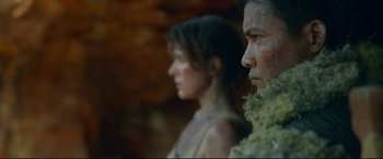 Movie still from “Monster Hunter” (2020), directed by Paul W.S. Anderson – A man and a woman standing next to each other; Close Up shot, Low angle