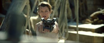 Movie still from “Monster Hunter” (2020), directed by Paul W.S. Anderson – Milla jovovich in a scene from resident evil : retribution; Close Up shot, Low angle