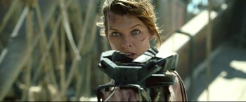 Movie still from “Monster Hunter” (2020), directed by Paul W.S. Anderson – A person holding a camera; Close Up shot, Low angle