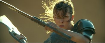 Movie still from “Monster Hunter” (2020), directed by Paul W.S. Anderson – Milla jovovich in a scene from resident evil : the final chapter; Close Up shot, Low angle