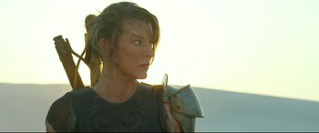 Movie still from “Monster Hunter” (2020), directed by Paul W.S. Anderson – A person wearing a costume; Close Up shot, Over the shoulder angle