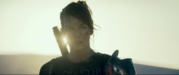 Movie still from “Monster Hunter” (2020), directed by Paul W.S. Anderson – A person wearing a costume; Close Up shot, Low angle