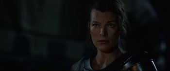 Movie still from “Monster Hunter” (2020), directed by Paul W.S. Anderson – A person looking at the camera; Close Up shot, Over the shoulder angle