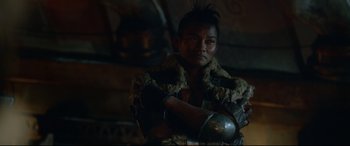 Movie still from “Monster Hunter” (2020), directed by Paul W.S. Anderson – A man in a leather jacket and a fur coat; Close Up shot, Over the shoulder angle