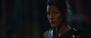 Movie still from “Monster Hunter” (2020), directed by Paul W.S. Anderson – A person wearing a shirt; Close Up shot, Over the shoulder angle