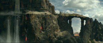 Movie still from “Monster Hunter” (2020), directed by Paul W.S. Anderson – A view of a castle on top of a cliff; Extreme Wide shot, High angle