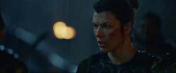 Movie still from “Monster Hunter” (2020), directed by Paul W.S. Anderson – A person wearing a black shirt; Close Up shot, Over the shoulder angle