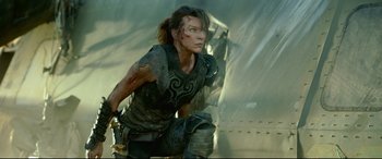 Movie still from “Monster Hunter” (2020), directed by Paul W.S. Anderson – Milla jovovich in a scene from resident evil : the final chapter; Medium shot, Low angle
