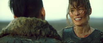 Movie still from “Monster Hunter” (2020), directed by Paul W.S. Anderson – A man and a woman are looking at each other; Close Up shot, Over the shoulder angle