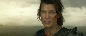 Movie still from “Monster Hunter” (2020), directed by Paul W.S. Anderson – A person with blood on her face; Close Up shot, Low angle