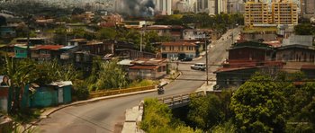 Movie still from “Monsters” (2010), directed by Gareth Edwards – A view of an urban area from a hill; Extreme Wide shot, High angle