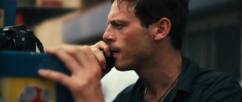 Movie still from “Monsters” (2010), directed by Gareth Edwards – A person talking on a cell phone; Close Up shot, Low angle