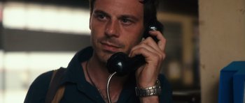 Movie still from “Monsters” (2010), directed by Gareth Edwards – A person talking on a phone; Close Up shot, High angle