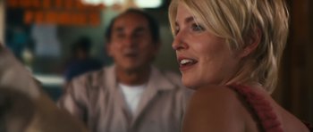 Movie still from “Monsters” (2010), directed by Gareth Edwards – A woman and a man are smiling for the camera; Close Up shot, Over the shoulder angle