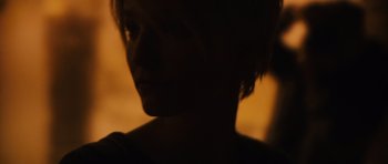 Movie still from “Monsters” (2010), directed by Gareth Edwards – A blurry picture of a woman's face in the dark; Extreme Close Up shot, Over the shoulder angle