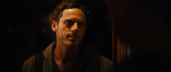 Movie still from “Monsters” (2010), directed by Gareth Edwards – A person wearing a jacket; Close Up shot, Over the shoulder angle