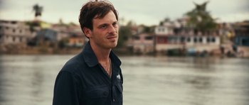 Movie still from “Monsters” (2010), directed by Gareth Edwards – A person near a body of water; Close Up shot, Over the shoulder angle