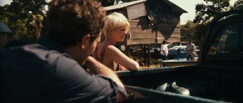 Movie still from “Monsters” (2010), directed by Gareth Edwards – A woman sitting next to a man on a boat; Medium shot, Over the shoulder angle