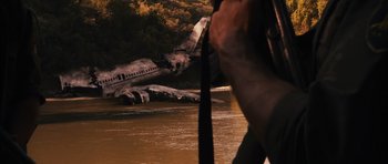 Movie still from “Monsters” (2010), directed by Gareth Edwards – A plane that is in a body of water; Extreme Wide shot, High angle