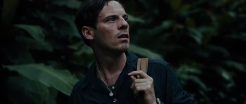 Movie still from “Monsters” (2010), directed by Gareth Edwards – A person holding a bag; Close Up shot, Low angle