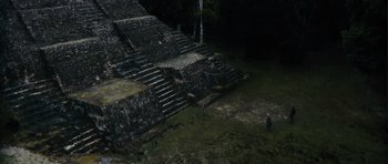 Movie still from “Monsters” (2010), directed by Gareth Edwards – A man standing in front of an ancient structure; Extreme Wide shot, High angle