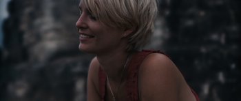 Movie still from “Monsters” (2010), directed by Gareth Edwards – A person with short blonde hair; Close Up shot, Low angle