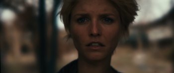 Movie still from “Monsters” (2010), directed by Gareth Edwards – A person with short hair; Close Up shot, Low angle