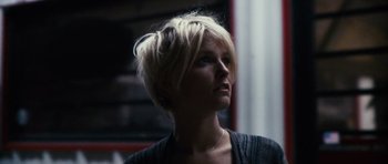 Movie still from “Monsters” (2010), directed by Gareth Edwards – A woman with short blonde hair looking up at the ceiling; Close Up shot, Low angle