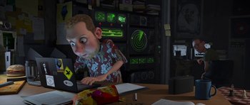 Movie still from “Monsters vs. Aliens” (2009), directed by Conrad Vernon – An animated man sitting in front of a computer; Medium shot, Over the shoulder angle