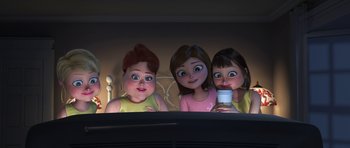 Movie still from “Monsters vs. Aliens” (2009), directed by Conrad Vernon – A group of three cartoon girls sitting next to each other in front of a bed; Medium shot, High angle
